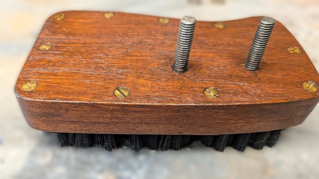 top of dabbing brush with screws poking out