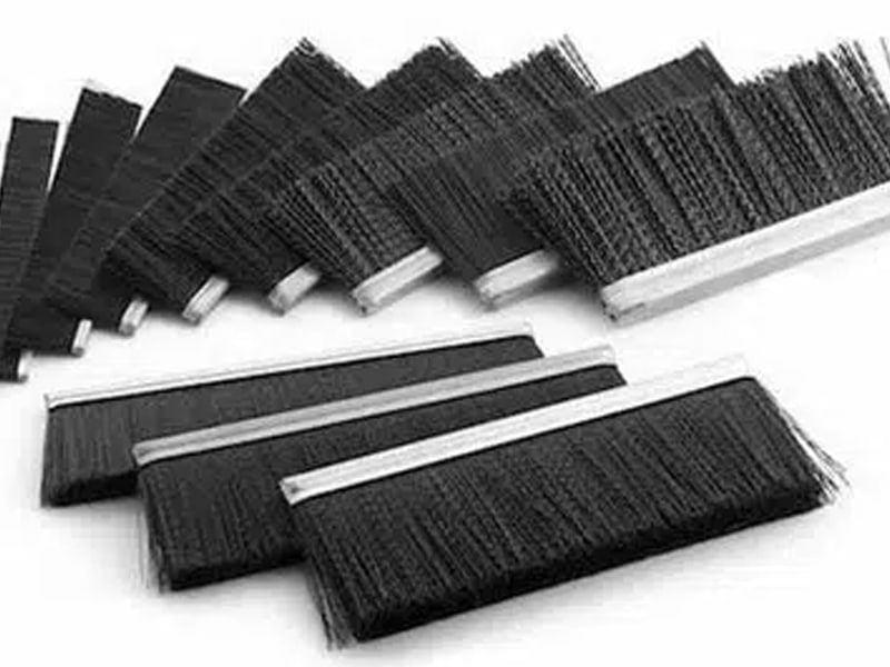 Silver brush holders with black bristles on a strip brush