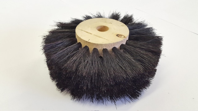 black punched in brush with wooden middle